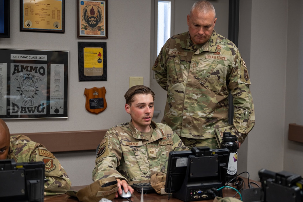 Chief Master Sgt. Russel Guajardo, right, command munitions functional manager with Headquarters Air Force Reserve Command, helps Staff Sgt. Alexander Bodamer during a fragmentation order preparation exercise at Beale Air Force Base, California, June 11, 2026.
