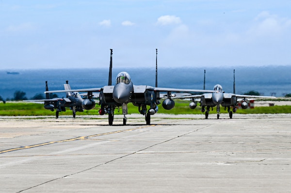 A U.S. Air Force F-15EX Eagle II and F-15E Strike Eagles assigned to 85th Test and Evaluation Squadron, Eglin Air Force Base, Florida, land at Kadena Air Base, Japan, June 29, 2026.