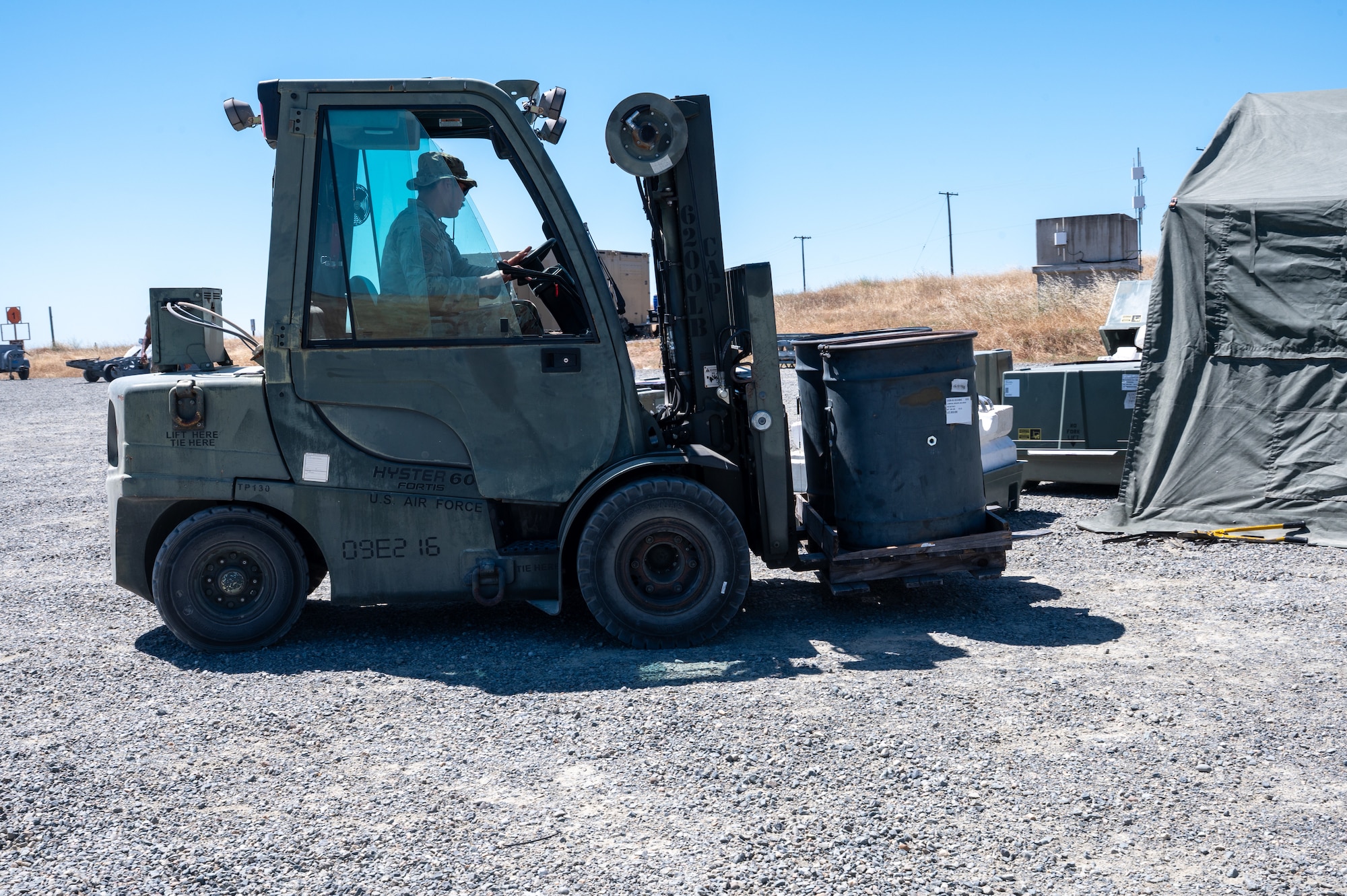 U.S. Air Force Staff Sgt. Devon Klostermann, a student assigned to the Air Force Combat Ammunition Center Class 26-006, uses a forklift to move barrels during a fragmentation order preparation exercise at Beale Air Force Base, California, June 12, 2026.