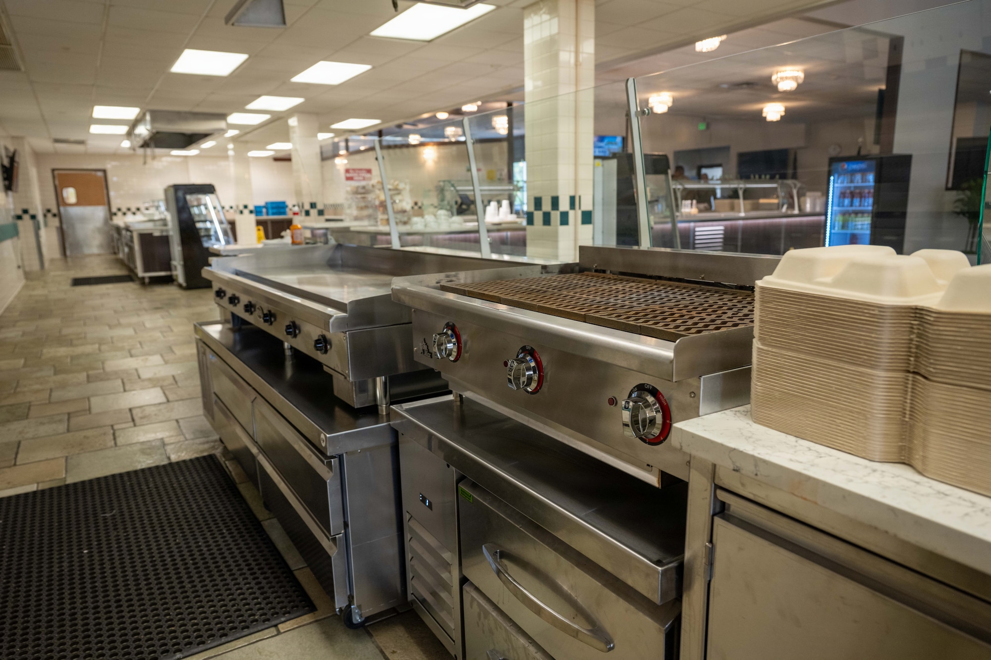 Interior view of the Hale ʻAina Dining Facility shows a renovated serving area at Joint Base Pearl Harbor-Hickam, Hawaii, June 17, 2026. The renovation project includes updates to serving line layouts, lighting, customer flow and food safety equipment to improve dining operations and service efficiency. (U.S. Air Force photo by Staff Sgt. Mark Sulaica)