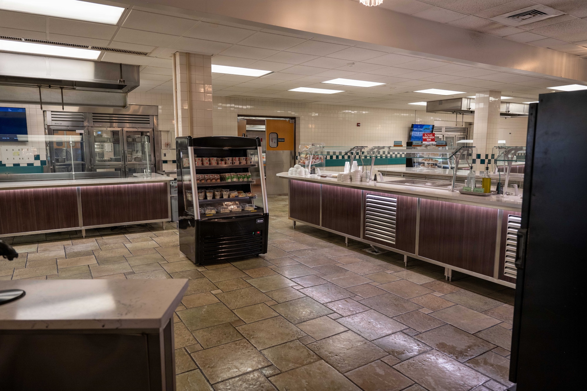 Interior view of the Hale ʻAina Dining Facility shows a renovated serving area at Joint Base Pearl Harbor-Hickam, Hawaii, June 17, 2026. The renovation project includes updates to serving line layouts, lighting, customer flow and food safety equipment to improve dining operations and service efficiency. (U.S. Air Force photo by Staff Sgt. Mark Sulaica)
