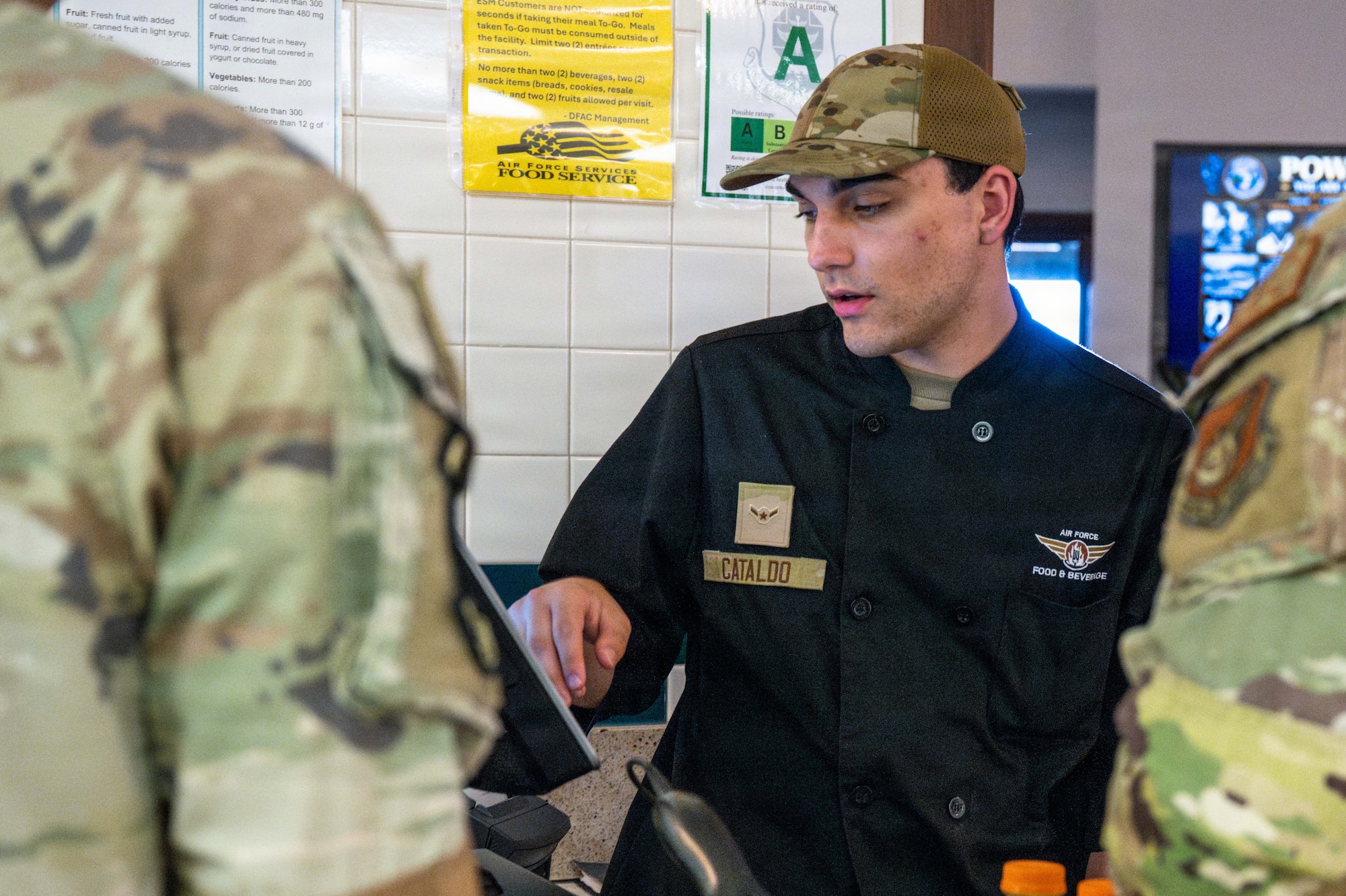 U.S. Air Force Airman David Cataldo, 647th Force Support Squadron food services, operates a register at the Hale ‘Aina Dining Facility on Joint Base Pearl Harbor-Hickam, June 26, 2026. The Hale ʻAina Dining Facility provides nutritious meal options to authorized patrons, including U.S. service members, partner nation personnel and other individuals with dining privileges on the installation. (U.S. Air Force photo by Staff Sgt. Mark Sulaica)