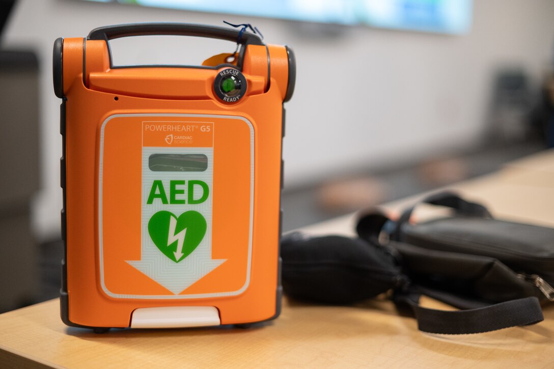An automated external defibrillator (AED) unit is shown outside of its case at Sacramento District headquarters. AEDs are positioned next to restrooms on each floor of the building, ensuring staff have quick access to the life-saving devices during an emergency. (U.S. Army photo by Grant Okubo)