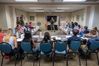 Col. Michelle M. Williams, U.S. Army Financial Management Command commander, center, speaks to 19 students participating a Future Presidents of America program as Command Sgt. Maj. Joy L. Allen, USAFMCOM senior enlisted advisor, and 1st Lt. Brandon Hale, USAFMCOM executive officer, right, listen along at the Benjamin Harrison Presidential Site in Indianapolis June 30, 2026. The site’s Future Presidents of America program is a youth leadership camp with a mission of developing individual confidence, civic literacy and good citizenship to reveal the exceptional qualities of character that make for great presidents and leaders. (U.S. Army photo by Mark R. W. Orders-Woempner)