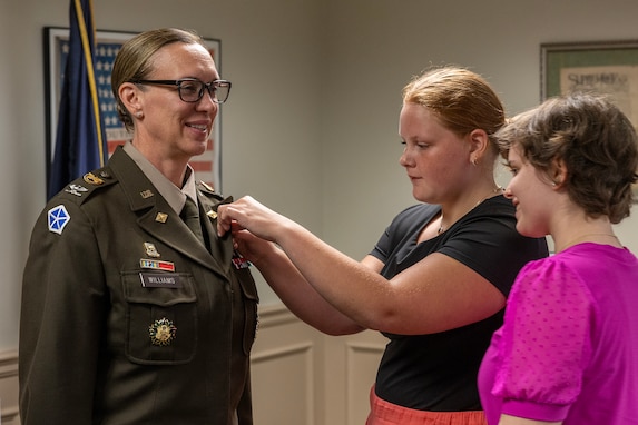 Students participating a Future Presidents of America program present a special pin to Col. Michelle M. Williams, U.S. Army Financial Management Command commander, at the Benjamin Harrison Presidential Site in Indianapolis June 30, 2026. The site’s Future Presidents of America program is a youth leadership camp with a mission of developing individual confidence, civic literacy and good citizenship to reveal the exceptional qualities of character that make for great presidents and leaders. (U.S. Army photo by Mark R. W. Orders-Woempner)