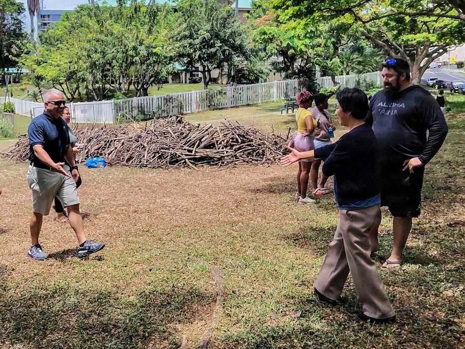 Rear Adm. Lester Ortiz, deputy commander, Navy Closure Task Force-Red Hill (NCTF-RH), greets Hawaii State Rep. Linda Ichiyama during a Genki Ball toss in Honolulu, May 28, 2026. About 1,000 Genki Balls, handmade mud spheres packed with beneficial microbes, were thrown in the water to help naturally revitalize the Salt Lake Waterway. NCTF-RH continues to engage with the people of Hawaii, regulatory agencies, and other stakeholders as it safely and deliberately decommissions the Red Hill Bulk Fuel Storage Facility. (U.S. Navy photo by Mass Communication Specialist 2nd Class Krystal Diaz)