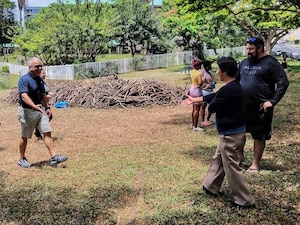 Rear Adm. Lester Ortiz, deputy commander, Navy Closure Task Force-Red Hill (NCTF-RH), greets Hawaii State Rep. Linda Ichiyama during a Genki Ball toss in Honolulu, May 28, 2026. About 1,000 Genki Balls, handmade mud spheres packed with beneficial microbes, were thrown in the water to help naturally revitalize the Salt Lake Waterway. NCTF-RH continues to engage with the people of Hawaii, regulatory agencies, and other stakeholders as it safely and deliberately decommissions the Red Hill Bulk Fuel Storage Facility. (U.S. Navy photo by Mass Communication Specialist 2nd Class Krystal Diaz)