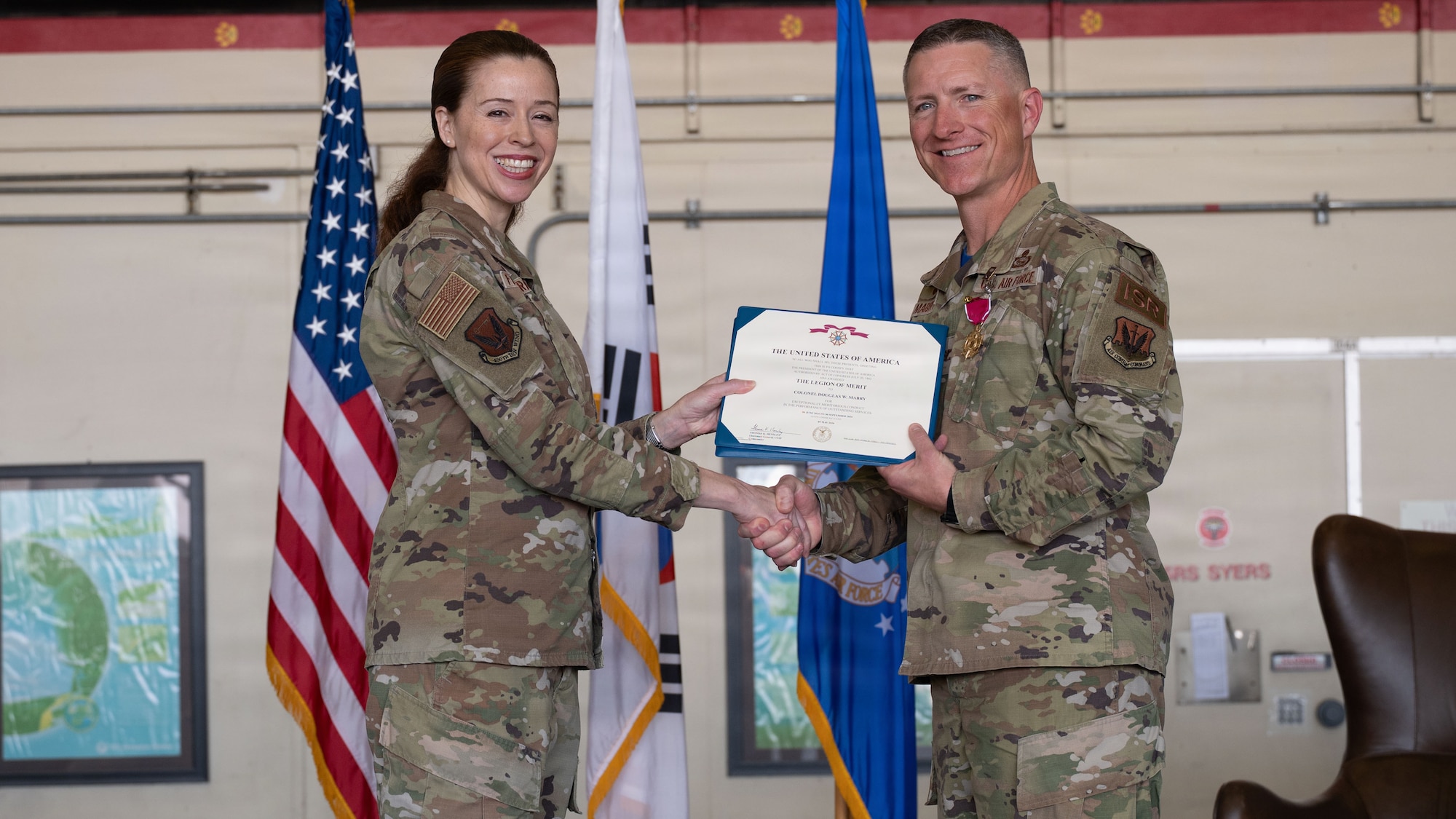 U.S. Airmen attend a change of command ceremony.