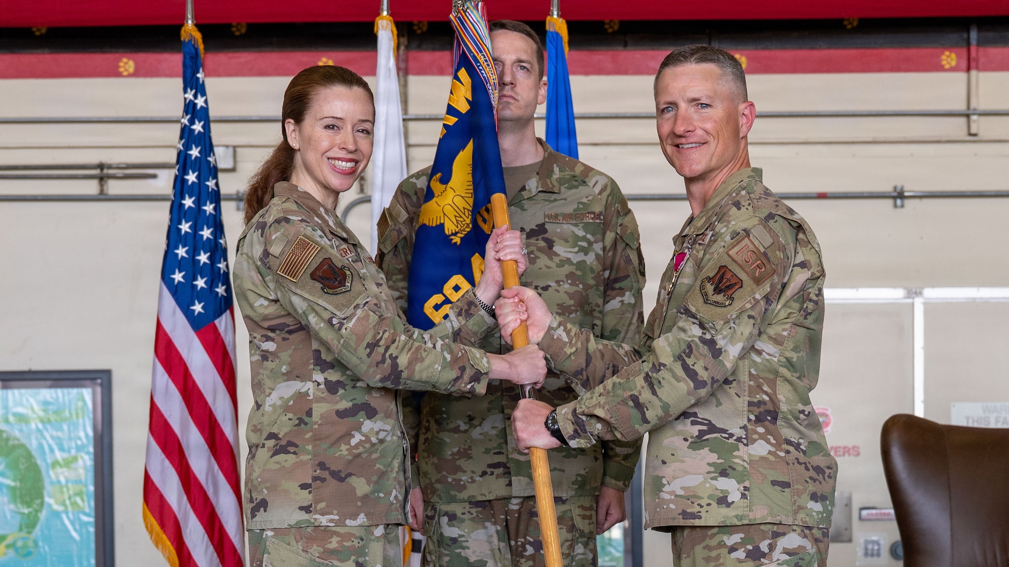 U.S. Airmen attend a change of command ceremony.