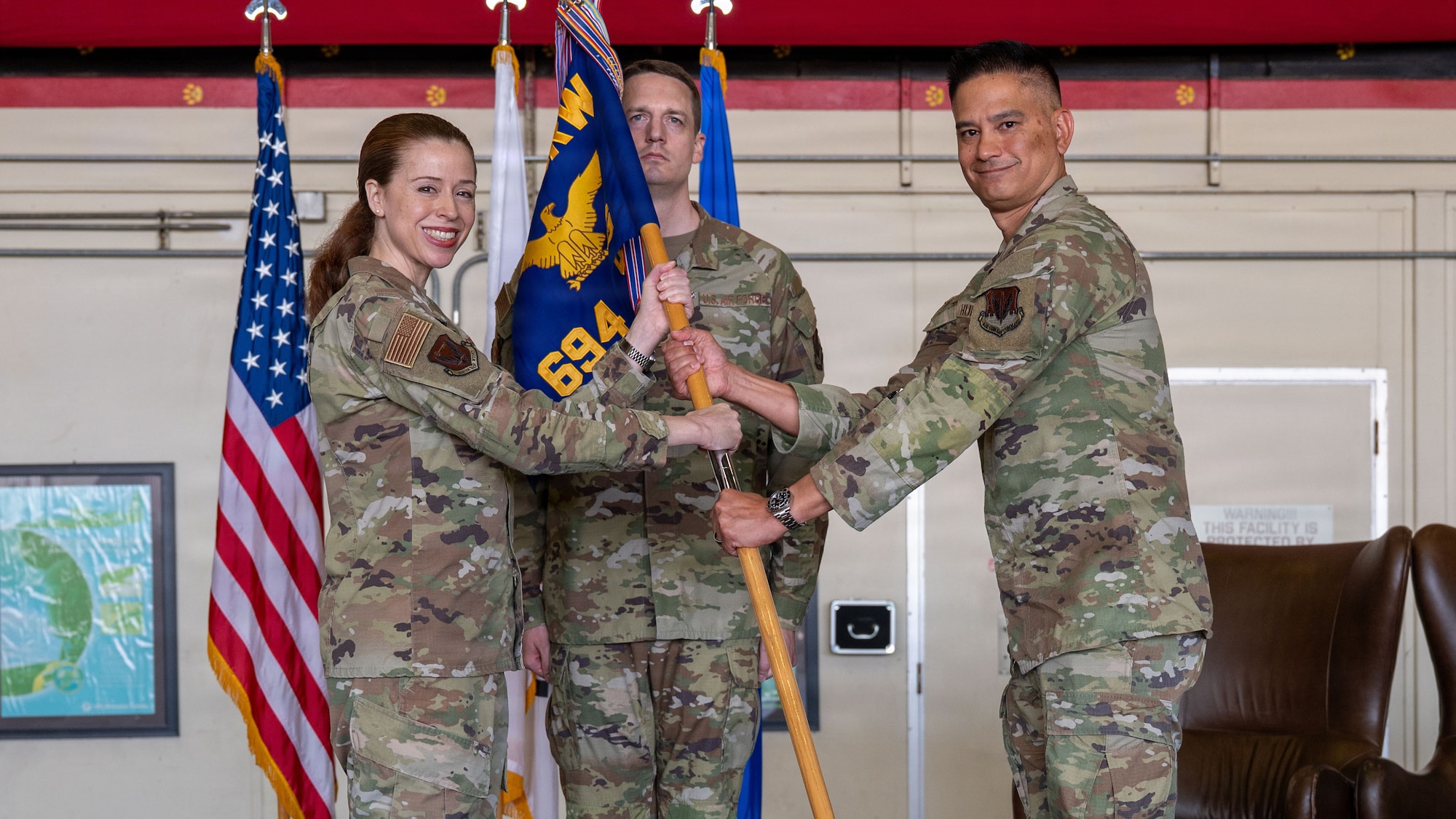 U.S. Airmen attend a change of command ceremony.
