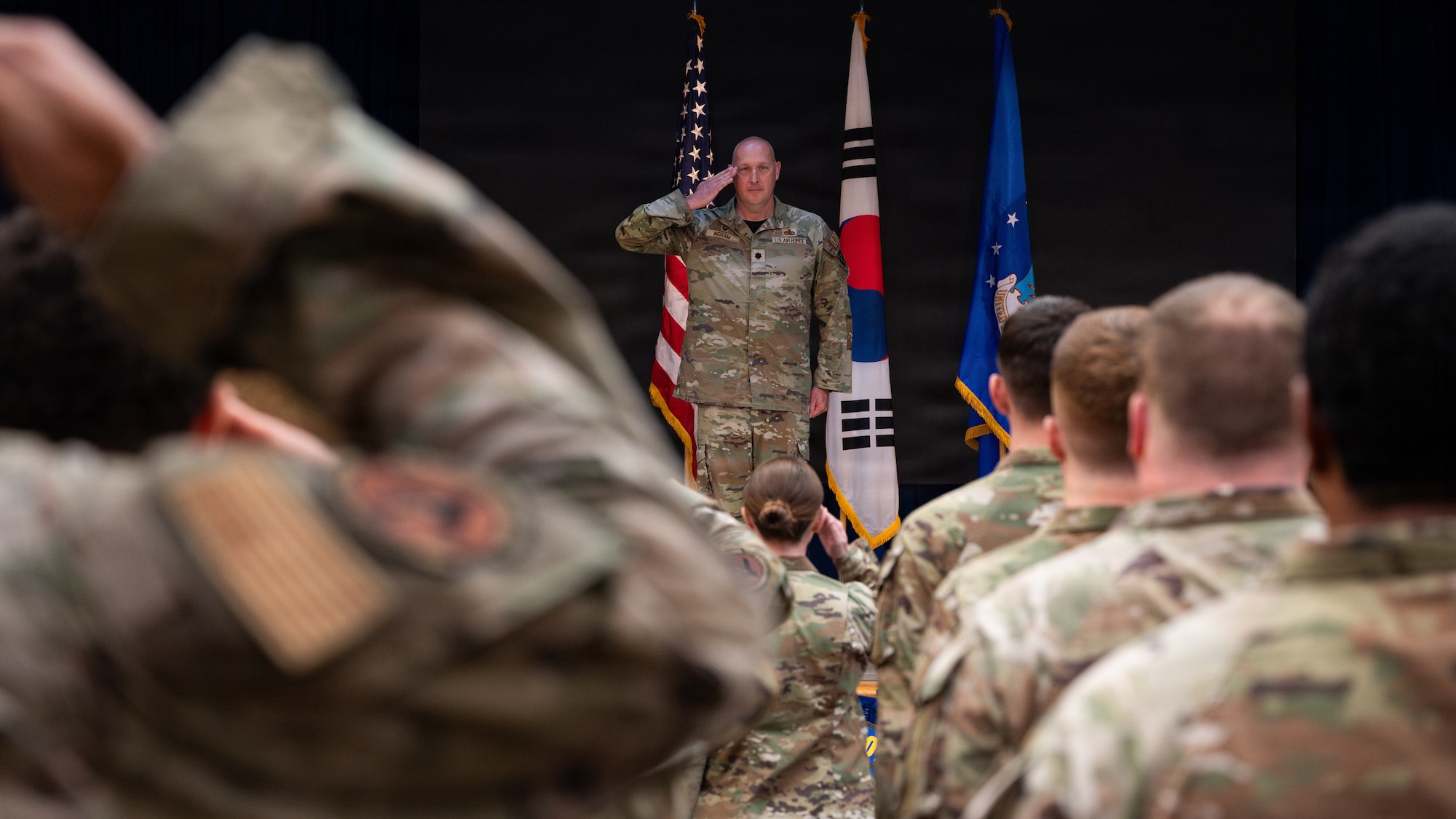 A flight salutes their incoming commander