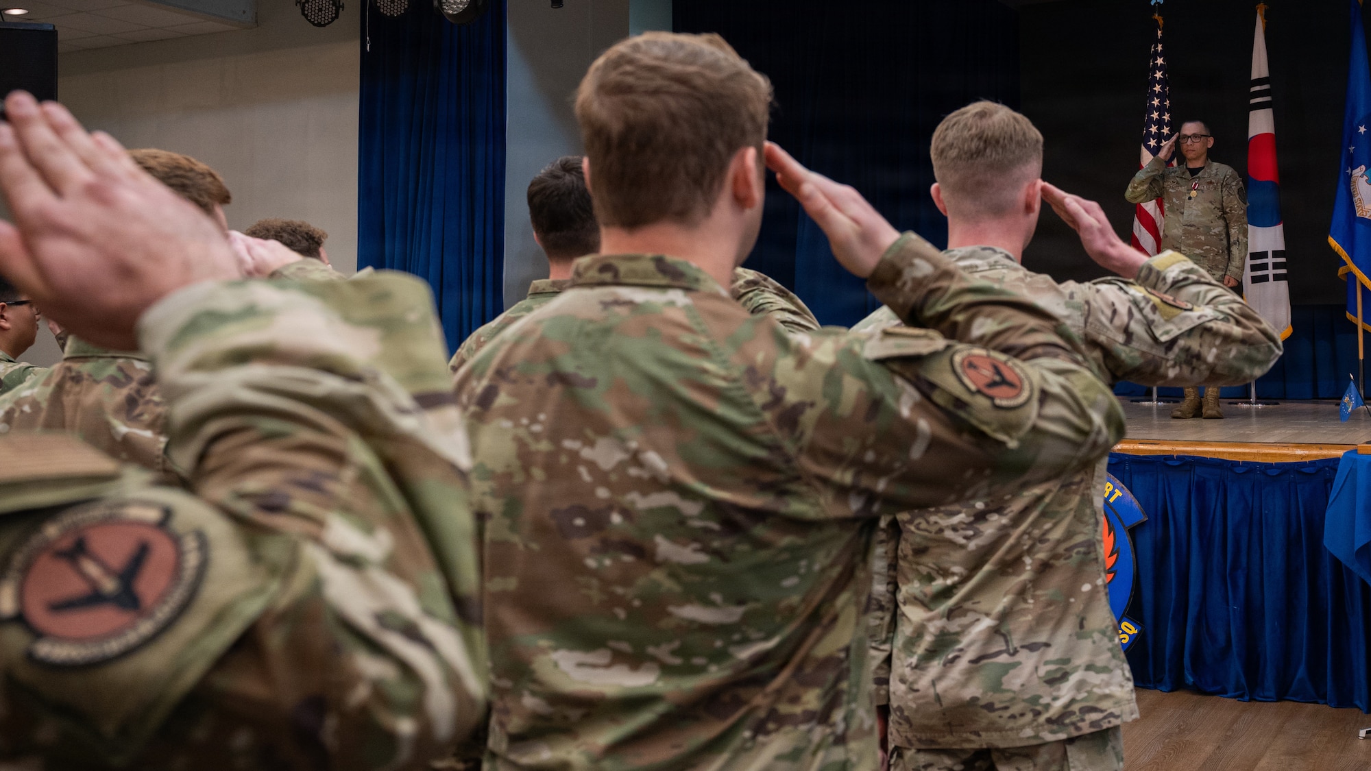 A flight salutes their outgoing commander.