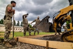 U.S. Airmen with the 121st Air Refueling Wing Civil Engineer Squadron, Ohio Air National Guard, prepare a site to pour a concrete pad to complete their annual training requirements at Yokota Air Base, Japan, June 4, 2026. The 121st CE Squadron was deployed to Japan for a Deployment for Training, a temporary duty program where Air National Guard CE Airmen deploy to active-duty bases to conduct training by assisting with real-world projects. (U.S. Air National Guard photo by Airman 1st Class Taylor Warehime)