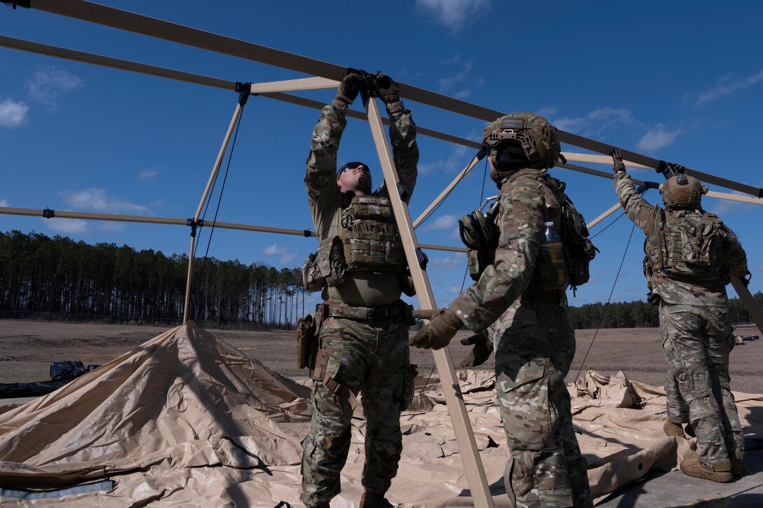 U.S. Air Force Airman 1st Class Kivian Farraro, an air transportation journeyman assigned to the 156th Contingency Response Group, Puerto Rico Air National Guard, assembles a tent during exercise Sentry South-Southern Strike at Camp Shelby, Hattiesburg, Mississippi, Feb. 3, 2025. Exercise Sentry South-Southern Strike is a joint military partnership that strengthens contingency response operations, agile combat employment, aeromedical evacuation, joint maritime training, specialized fueling operations and intra-theater airlift and airdrop. (U.S. Air National Guard photo by Senior Airman Gisselle Toro Caraballo)