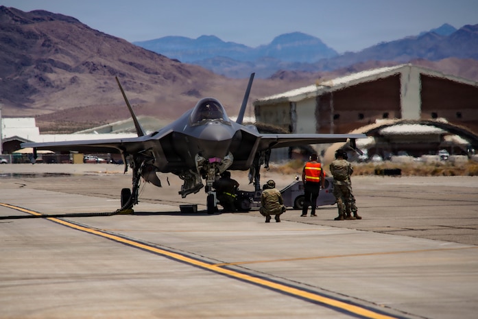 A U.S. Air Force F-35A Lightning II aircraft assigned to the 65th Aggressor Squadron receives a hot-pit refuel on the flightline at Creech Air Force Base, Nevada, June 17, 2026. The exercise brought together support from five wings, seven groups and 17 squadrons across maintenance, logistics, operations, medical, security, safety, fuels, fire emergency services, airfield operations and host-base support. (U.S. Air Force photo by Staff Sgt. Jake Jacobsen)
