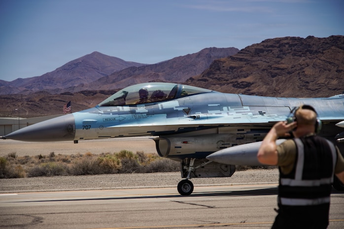 A U.S. Air Force F-16C Fighting Falcon aircraft assigned to the 64th Aggressor Squadron taxis to the runway during exercise VENOM FORGE at Creech AFB June 17, 2026. The exercise was the capstone event for a course aimed at familiarizing Airmen with commander’s intent, communication under friction, generating aircraft, and creating the conditions for combat airpower to take place. (U.S. Air Force photo by Staff Sgt. Jake Jacobsen)