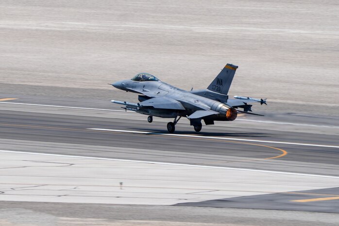 A U.S. Air Force F-16C Fighting Falcon aircraft assigned to the 64th Aggressor Squadron takes off from the runway during exercise VENOM FORGE at Creech Air Force Base June 17, 2026. These exercises help maintain the skills required to maintain advanced airpower in operations worldwide. (U.S. Air Force photo by Airman Vinh Phan)