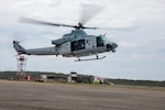 A U.S. Marine Corps UH-1Y Venom assigned to Marine Medium Tiltrotor Squadron (VMM) 365 (Reinforced), Littoral Combat Force-24, prepares to land during an aerial damage assessment flight, at Simón Bolívar International Airport, Caracas, Venezuela, June 28, 2026. At the direction of U.S. Southern Command, assigned U.S. military forces are supporting Department of State-led U.S. disaster assistance to the people of Venezuela in the aftermath of the June 24, 2026, earthquakes. (U.S. Marine Corps photo)