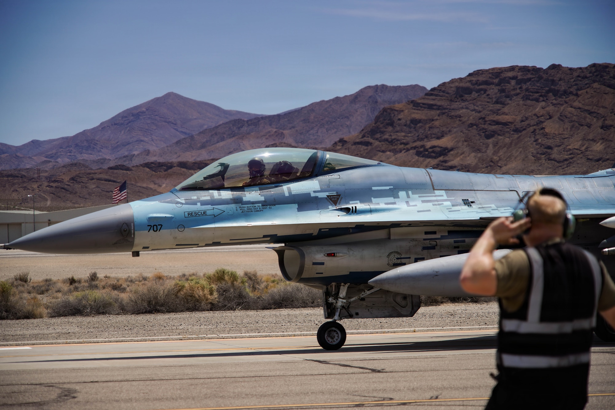 A U.S. Air Force F-16C Fighting Falcon aircraft assigned to the 64th Aggressor Squadron taxis to the runway during exercise VENOM FORGE at Creech AFB June 17, 2026. The exercise was the capstone event for a course aimed at familiarizing Airmen with commander’s intent, communication under friction, generating aircraft, and creating the conditions for combat airpower to take place. (U.S. Air Force photo by Staff Sgt. Jake Jacobsen)