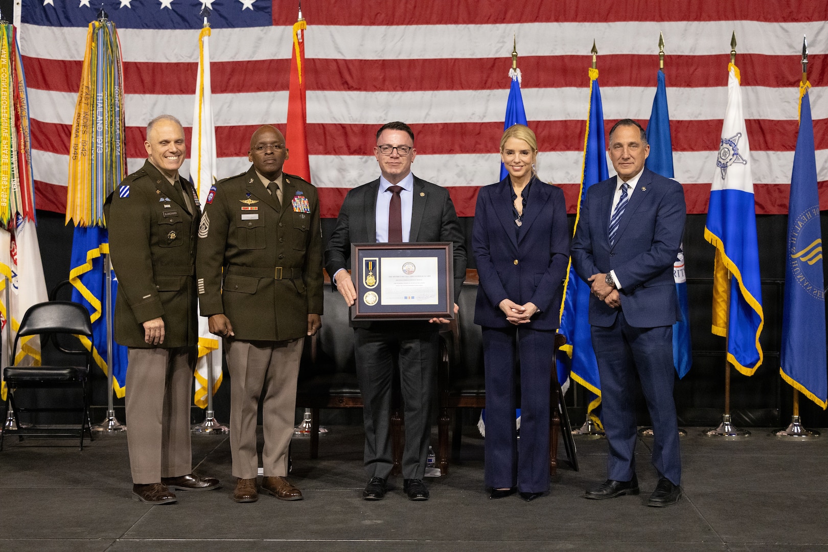 Brig. Gen. Leland D. Blanchard II, Commanding General (Interim) of the District of Columbia National Guard, hosts a Law Enforcement Recognition Ceremony recognizing partner law enforcement agencies at the D.C. Armory, Feb. 26, 2026. Distinguished guests included U.S. Attorney General Pam Bondi; Gady Serralta, Director of the U.S. Marshals Service; and Jeffery Carroll, Interim Chief of Police for Metropolitan Police Department. The ceremony recognized officers from 10 local and federal law enforcement agencies for their partnership with the National Guard and contributions to public safety in support of the D.C. Safe and Beautiful mission. Officers received the District of Columbia National Guard Commendation Medal, Meritorious Service Medal or Distinguished Service Medal based on their individual achievements and level of impact.