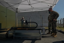 U.S. Marine Corps Brig. Gen. Kevin G. Collins, right, the commanding general of 3rd Marine Logistics Group, views the capabilities of a FastCut CNC plasma cutting table during a training and technology exposition on Camp Kinser, Okinawa, Japan, Feb. 5, 2026. The Marines showcased the equipment to senior enlisted leaders and officers, highlighting its potential to support future Marine Corps operations. (U.S. Marine Corps photo by Cpl. Pedro Rojas)