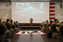 U.S. Air Force Col. Jack Johnson, 252nd Cyber Operations Group commander, Washington Air National Guard, speaks during the Cyber Protection Team Conference 2026 at the Pierce County Readiness Center, Camp Murray, Washington, Feb. 23, 2026.