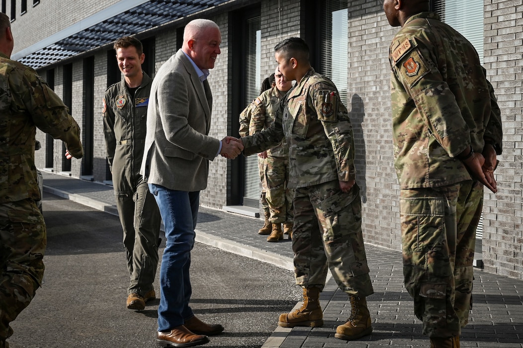 U.S. Air Force Lt. Col. Claire Vazquez, 701st Munitions Support Squadron commander, greets Bill White, U.S. Ambassador to Belgium, during a base visit.