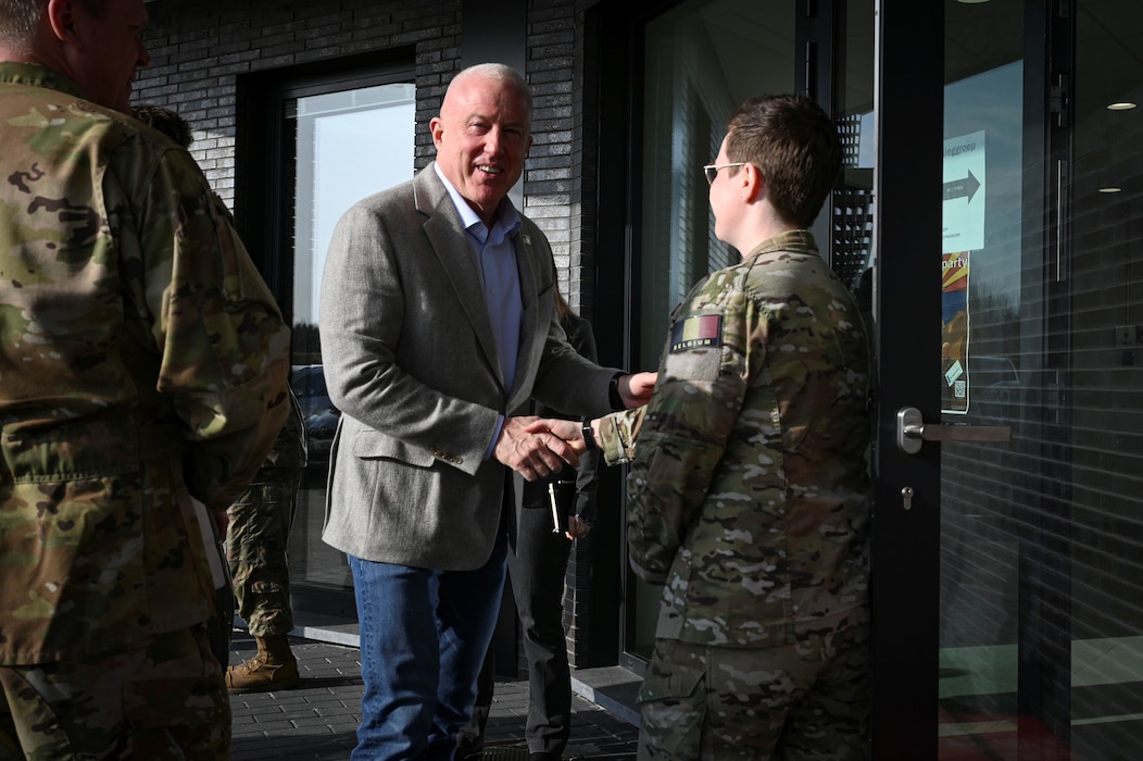 Belgian Air Force Capt. Magali Boerjan, right, 10th Tactical Wing adjunct officer, greets Bill White, U.S. Ambassador to Belgium, during a base visit.