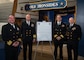 WASHINGTON (January 15th, 2026) -- (Left to Right) Capt. Ryan Gaul, Commanding Officer, Naval Support Activity Washington, Vice Admiral Scott Gray, Commander, Navy Installations Command, Rear Admiral Carey Cash, Chaplain of the Marine Corps, and Rear Adm. David Faehnle, Commandant, Naval District Washington, pose for a photo after signing a proclamation recognizing January as Spiritual Readiness month at the Navy Museum on the Washington Navy Yard. The proclamation underscores the Navy’s commitment to strengthening physical, mental and spiritual readiness and resilience to support mission success for Sailors and their families.  (U.S. Navy photo by Mass Communication Specialist 1st Class Griffin Kersting)