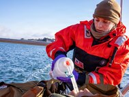 U.S. Navy Lt. Hannah Cunningham, assigned to En-route Care System (ERCS) Team 52, treats a patient aboard a Rigid Hull Inflatable Boat (RHIB) during a ship-to-shore medical evacuation exercise as part of ARCTIC EDGE 2026 (AE26) in Kodiak, Alaska, Feb. 26, 2026. AE26 is a NORAD and U.S. Northern Command-led homeland defense exercise designed to improve readiness, demonstrate capabilities, and enhance Joint and Allied Force interoperability in the Arctic. (U.S. Navy photo by Mass Communication Specialist 1st Class Abigayle Lutz)