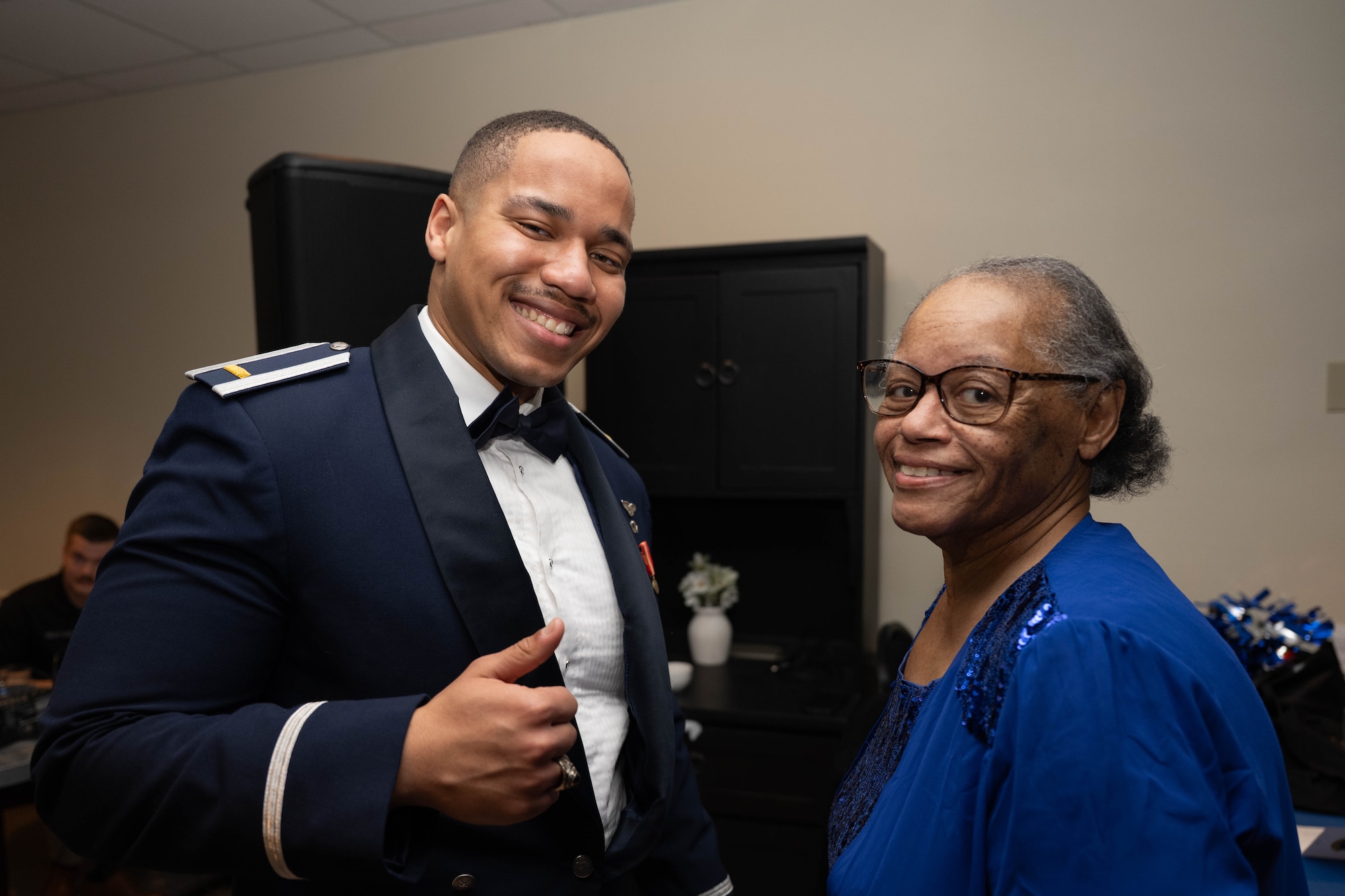 U.S. Air Force 2nd Lt. Timothy Martin and a loved one pose for a photo during the graduation ceremony of Class 26-06 at Laughlin Air Force Base, Texas, Feb. 26, 2026. Class 26-06 consisted of twenty-four U.S. Air Force and Japanese officers successfully completing Undergraduate Pilot Training. (U.S. Air Force photo by Airman 1st Class Darryl Keith)