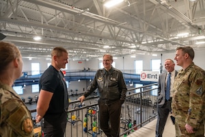 Richard L. Anderson, Assistant Secretary of the Air Force for Manpower and Reserve Affairs, and Adam Whisler, Guardian Resilience Team strength and conditioning coach, discuss changes to Schriever’s fitness programs.