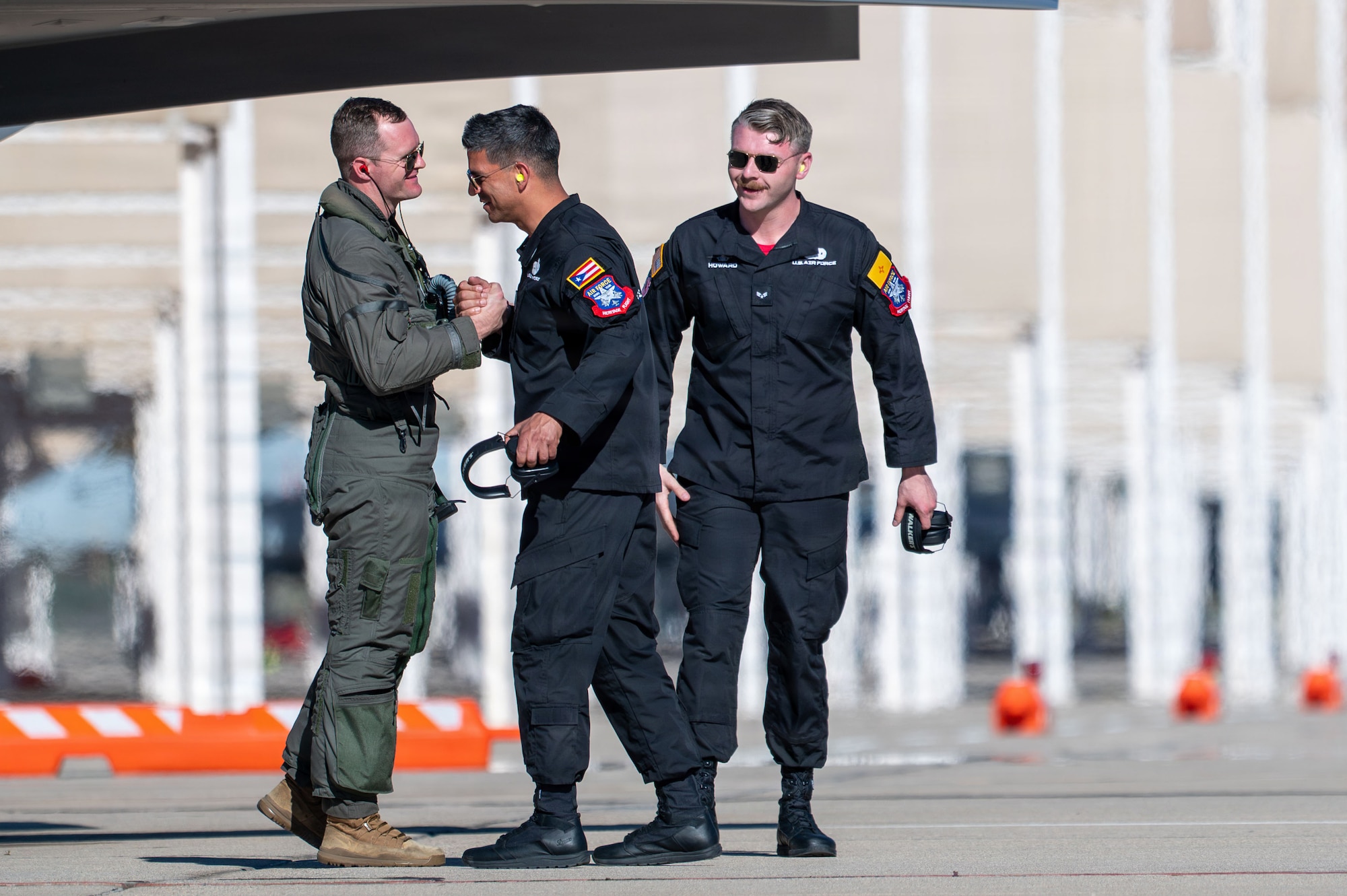 U.S. Air Force Maj. Sean “Rambo” Loughlin, F-35A Lightning II Demonstration Team pilot, celebrates with fellow demo team members after a successful aerial demonstration during the Heritage Flight Training Course at Davis-Monthan Air Force Base, Arizona, Feb. 27, 2026. The F-35A Demonstration Team, based out of Hill Air Force Base, Utah, showcases the unique aerial capabilities of the Air Force's most advanced multi-role stealth fighter. (U.S. Air Force photo by Senior Airman Jasmyne Bridgers-Matos)