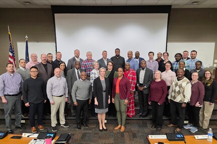U.S. Army Financial Management Command senior leaders, directors, staff leads and other key stakeholders pose for a photo during an offsite meeting at the Indiana National Guard’s Lawrence Readiness Center in Indianapolis Feb. 19, 2026. USAFMCOM held its annual offsite meeting to take a comprehensive review of its functions and tasks as the two-star major subordinate command continues to transform, modernize and innovate to meet the U.S. Army's continuous transformation needs through finance and comptroller operations that enable readiness and lethality throughout the Joint Force. (U.S. Army photo by Mark R. W. Orders-Woempner)