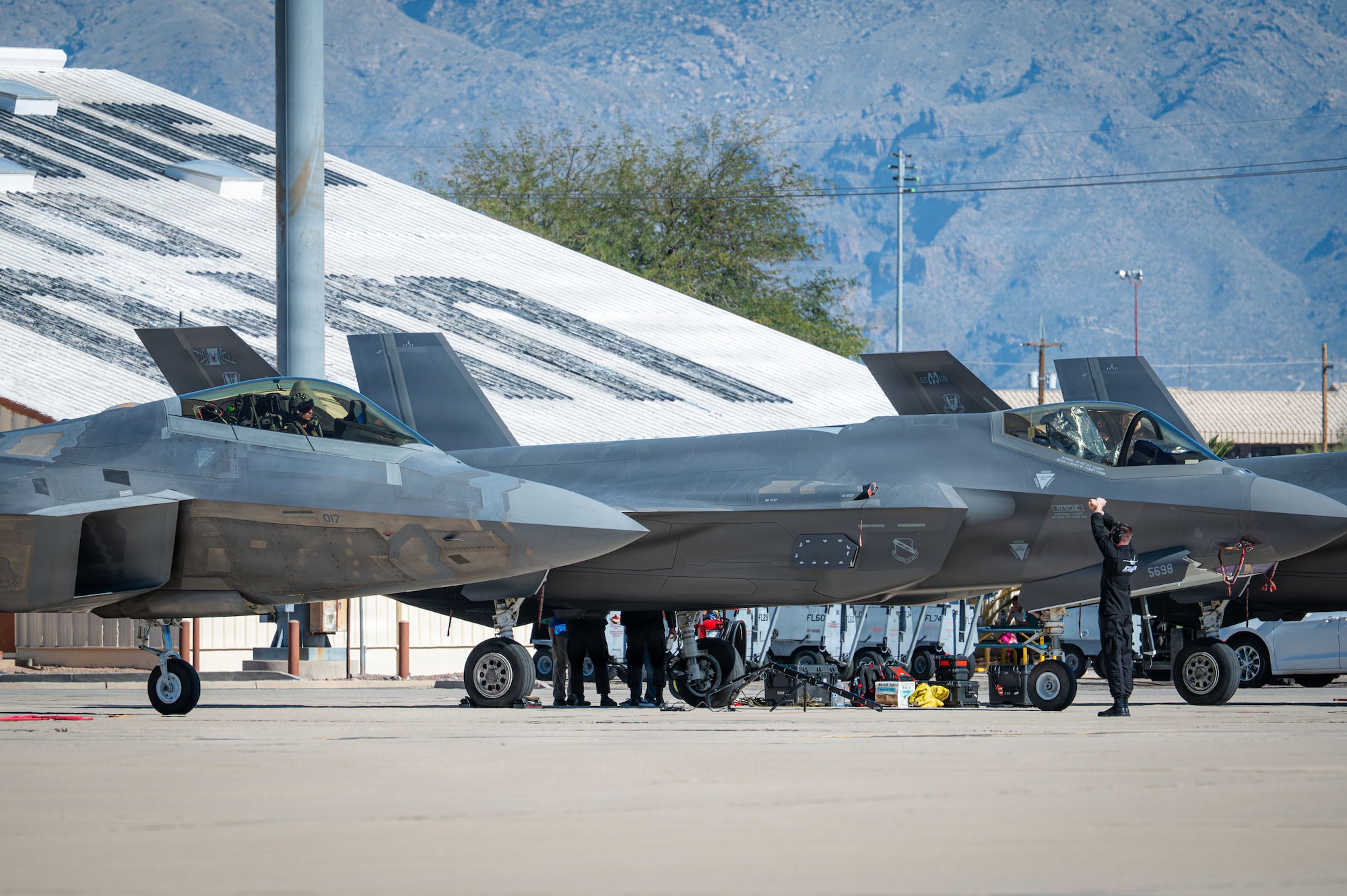U.S. Air Force Capt. Nicholas “Laz” Le Tourneau, F-22 Demonstration Team commander and pilot, taxis into place in an F-22 Raptor aircraft during the Heritage Flight Training Course at Davis-Monthan Air Force Base, Arizona, Feb. 28, 2026. The F-22 Demonstration Team consists of 14 specialized Airmen who maintain and support the Raptor's mission to provide undisputed air superiority. (U.S. Air Force photo by Senior Airman Jasmyne Bridgers-Matos)