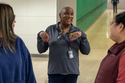 Kimberly Lawrence, U.S. Army Financial Management Command Military Pay Operations Sustainment and Training Division chief, talks with Army Military Pay Office employees at the Maj. Gen. Emmett J. Bean Federal Center in Indianapolis Feb. 27, 2026. Eleven employees from the AMPOs at Fort Drum, Fort Bliss, Fort Bragg, Fort Rucker, Fort Irwin, Fort Gordon, West Point and Aberdeen Proving Ground attended a reserve pay course, sponsored by the U.S. Army Reserve Center, from Feb. 23-27, 2026, in Indianapolis with the primary objective of enhancing the student’s the military pay knowledge on Army Reserve and Army National Guard pay in the AMPO network. (U.S. Army photo illustration by Mark R. W. Orders-Woempner)