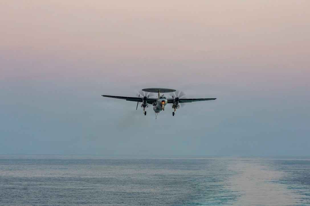 An E-2D Hawkeye, attached to Airborne Command & Control Squadron (VAW) 117, prepares to make an arrested landing on the flight deck of Nimitz-class aircraft carrier USS Abraham Lincoln (CVN 72) in support of Operation Epic Fury, Feb. 28, 2026. (U.S. Navy photo)