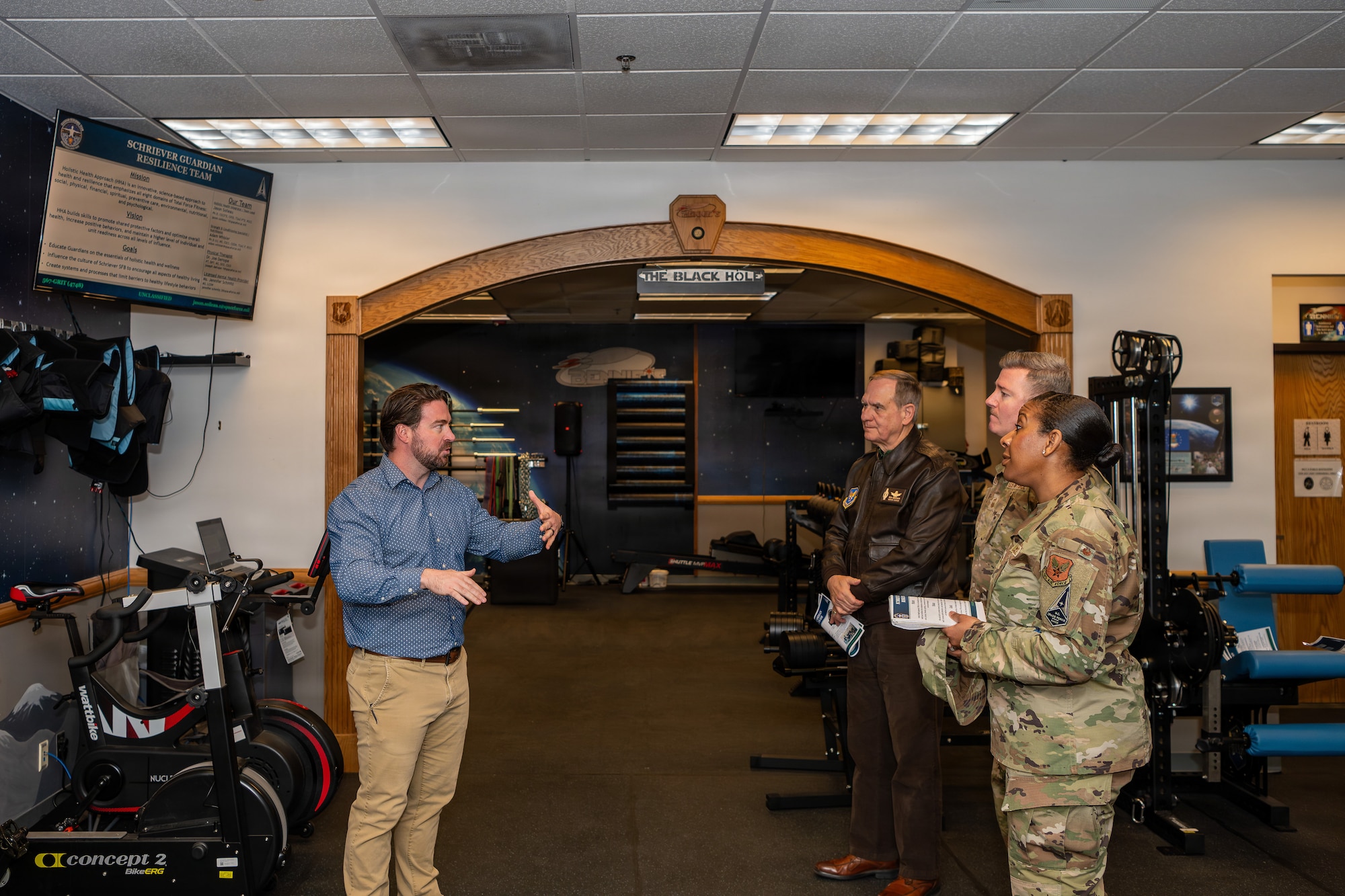 Richard L. Anderson, Assistant Secretary of the Air Force for Manpower and Reserve Affairs, and Jason Soileau, Guardian Resilience Team holistic health integrator, discuss the team’s role in supporting the mental and physical readiness of Guardians during a visit.