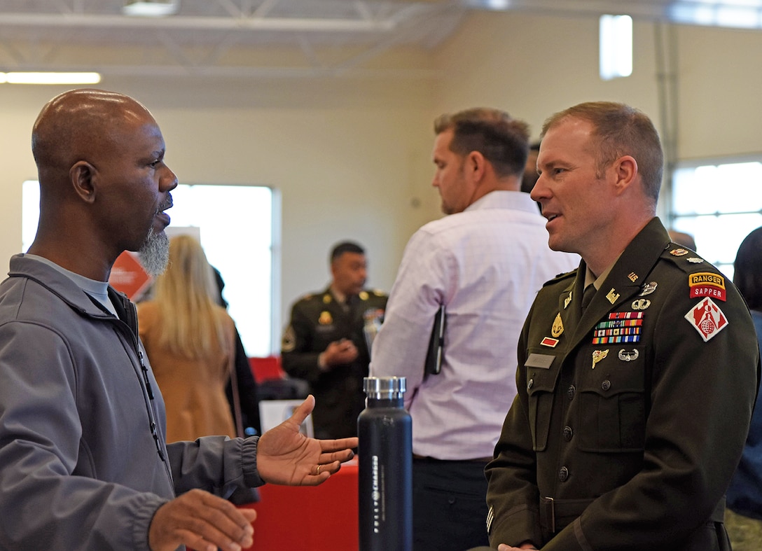 Albuquerque District Commander Lt. Col. Matthew Miller, right, speaks with one of the attendees during the district’s annual Business Opportunities Open House at the Sid Cutter Pilot’s Pavilion at the Balloon Fiesta Park in Albuquerque, N.M., Feb. 25, 2026.