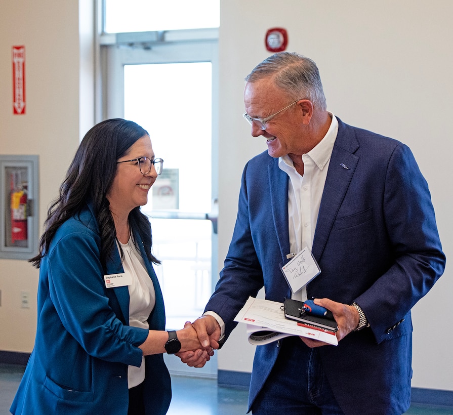 Stephanie Parra, left, deputy of the district’s Office of Small Business Programs, greets one of the attendees at the district’s annual Business Opportunities Open House at the Sid Cutter Pilot’s Pavilion at the Balloon Fiesta Park in Albuquerque, N.M., Feb. 25, 2026. Parra was the main organizer of the open house. The open house focused on networking with industry to discuss the USACE mission, highlight current Albuquerque District priorities, and build commitment to support upcoming opportunities.