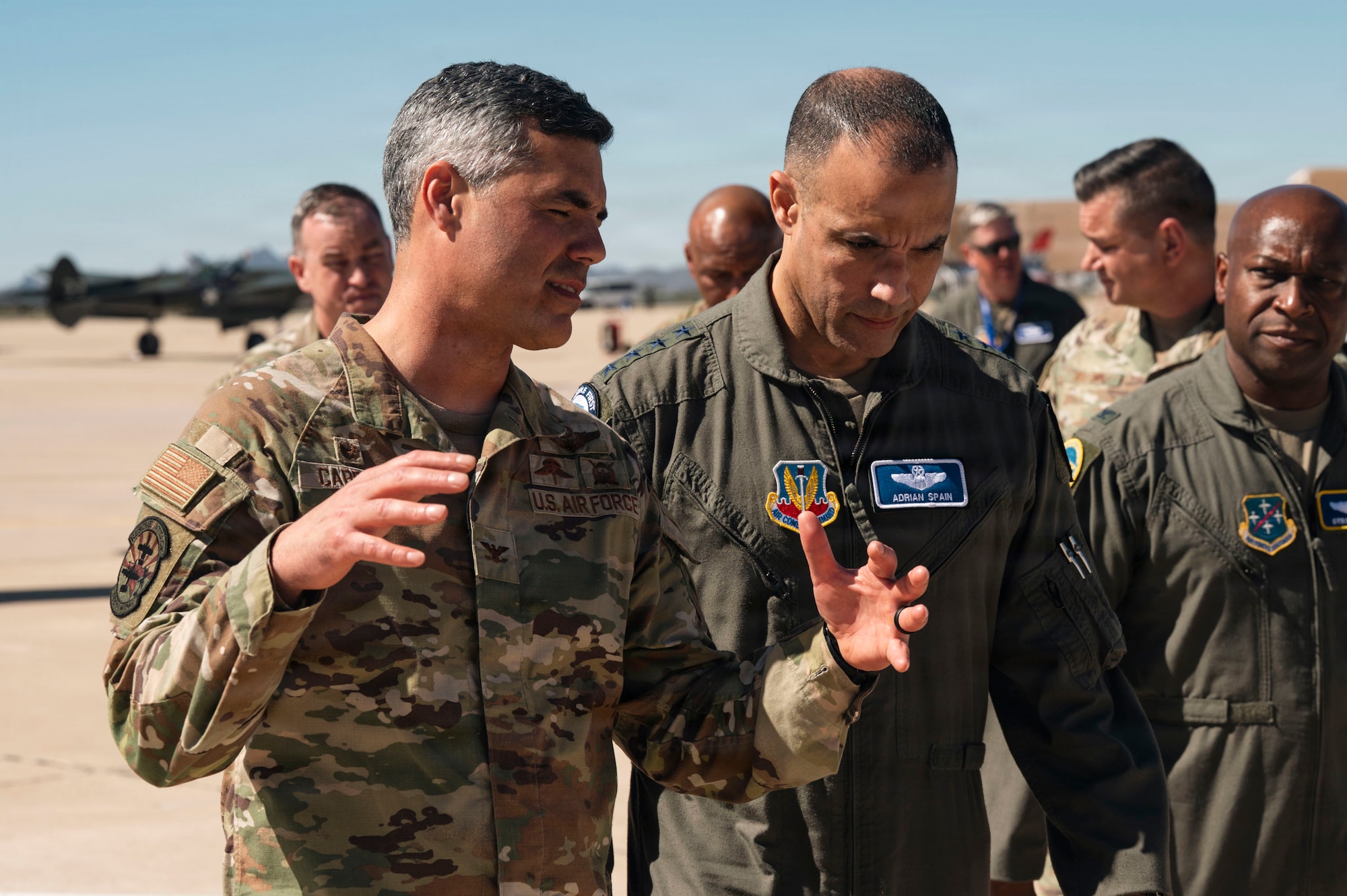 U.S. Air Force Gen. Adrian Spain, commander of Air Combat Command, walks with Col. Jose Cabrera, commander of the 355th Wing, at Davis-Monthan Air Force Base, Arizona, Feb. 26, 2026. Cabrera briefed Spain on the outstanding performance of Airmen assigned to the 563rd Rescue Group. (U.S. Air Force photo by Airman 1st Class Samantha Melecio)