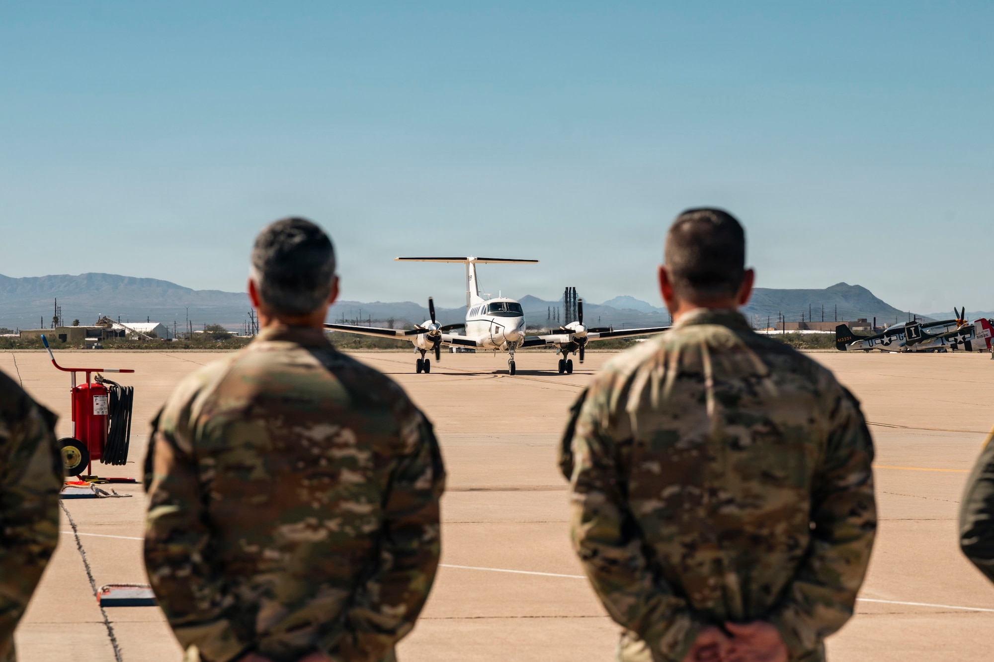 U.S. Air Force leaders from the 355th Wing and Air Forces Southern prepare for the arrival of Gen. Adrian Spain, commander of Air Combat Command, at Davis-Monthan Air Force Base, Arizona, Feb. 26, 2026. Spain was greeted by senior leaders upon arrival. (U.S. Air Force photo by Airman 1st Class Samantha Melecio)