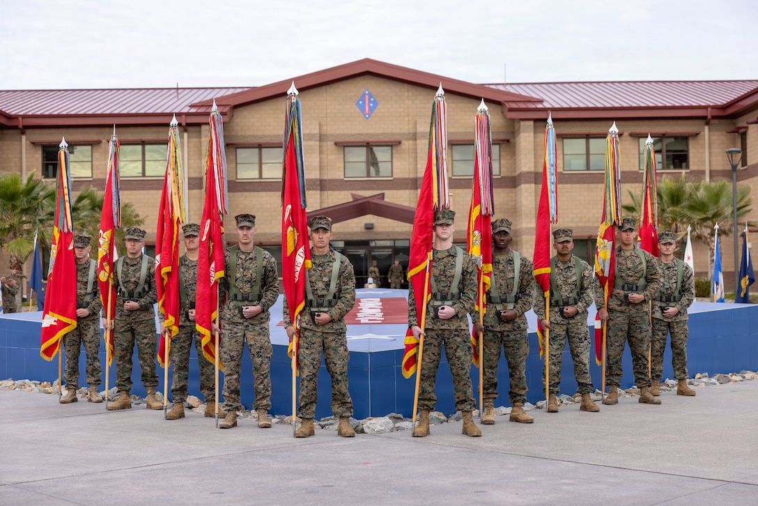 U.S. Marines with the 1st Marine Division color guard stand at parade rest during 1st MARDIV’s 85th colors rededication ceremony at Marine Corps Base Camp Pendleton, California, Feb. 20, 2026. Marines and Sailors celebrated the 1st MARDIV’s anniversary with a battle colors rededication ceremony. Each battle streamer represents a different award from campaigns ranging from World War II to Operation Enduring Freedom. (U.S. Marine Corps photo by Pfc. Ronnie Mejia)