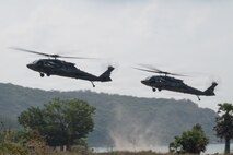 U.S. Marines assigned to Task Force Ashland, 15th Marine Expeditionary Unit, I Marine Expeditionary Force, prepare to land via Black Hawk during an amphibious exercise at Hat Yao Beach to support exercise Cobra Gold 26, Rayong Province, Thailand, Feb 26, 2026.
