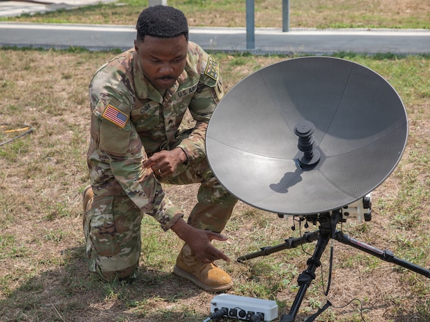 U.S. Army Sgt. Stanley Chima, assigned to 3rd Multi-Domain Task Force, adjusts components of a Tampa satellite aperture during Exercise Cobra Gold 2026 at U-Tapao Royal Thai Navy Airfield, Thailand, Feb. 25, 2026.