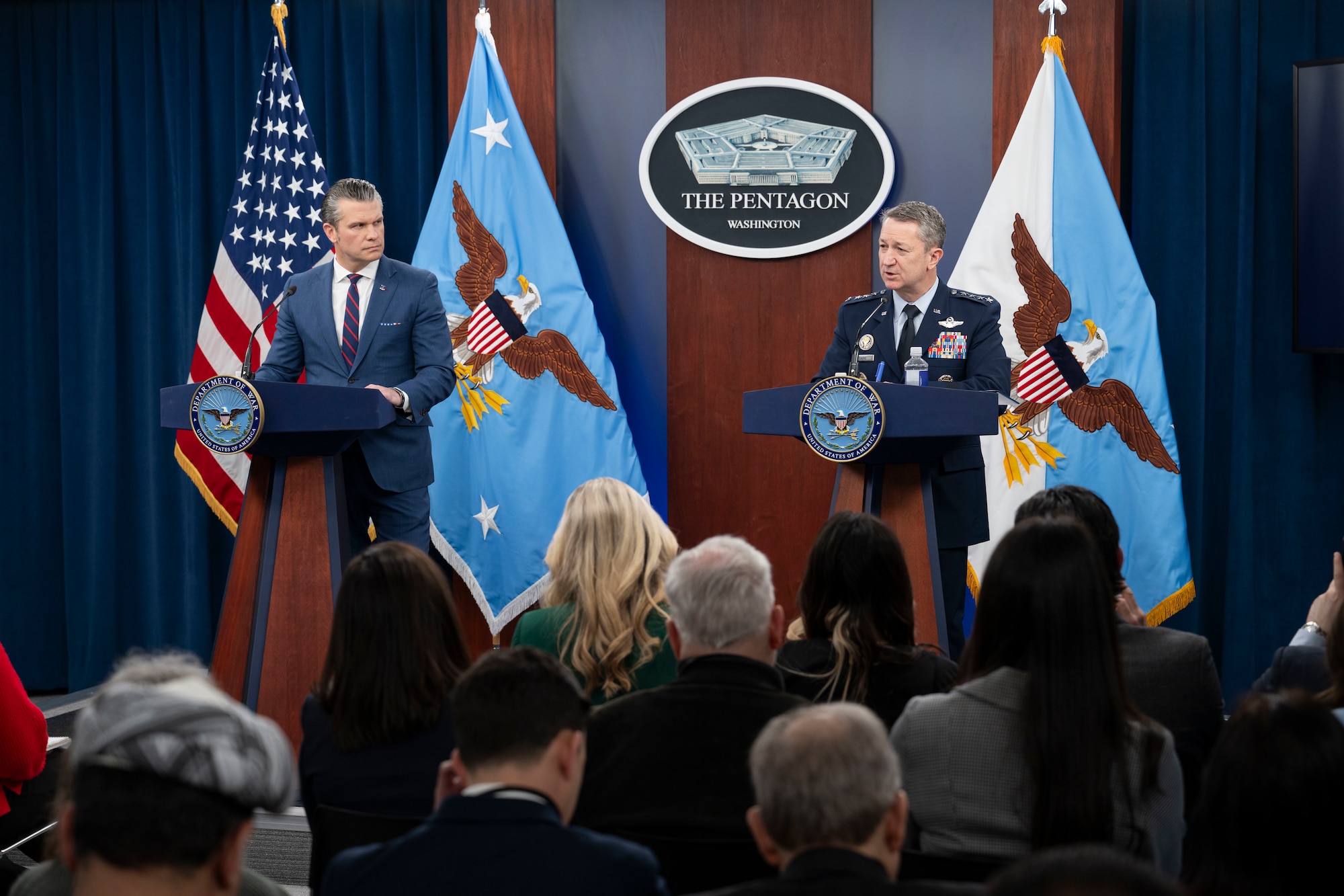 Secretary of War Pete Hegseth, left, and Air Force Gen. Dan Caine, chairman of the Joint Chiefs of Staff, conduct a press briefing about Operation Epic Fury at the Pentagon.