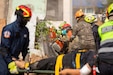 U.S. Air Force Tech. Sgt. Waylon Dashiell, 141st Civil Engineers, Washington Air National Guard, cuts a concrete wall alongside the Bangkok Fire and Rescue Department during the humanitarian assistance disaster relief demonstration, part of Exercise Cobra Gold 2026 at the Disaster Relief Training Centre, Phanom Sarakham District, Chachoengsao, Thailand, Feb. 27, 2026.