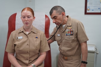 260201-N-FT324-4755. ROTA, Spain (Feb. 1, 2026) Cmdr. Frank Cornejo, a native of Carmel-by-the-Sea, California, assigned to Navy Medicine Readiness and Training Command Rota, conducts a medical examination on a patient during a routine clinical visit onboard U.S. Naval Hospital Rota. Cornejo serves as a physician assistant, providing comprehensive medical care to service members, their families and beneficiaries across the joint force to ensure they remain healthy, ready and mission capable in support of the warfighter. (U.S. Navy photo by Lt. Cmdr. Alicia Sacks)
