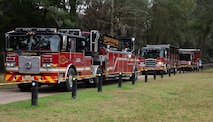 Fire trucks convoy into the training area.