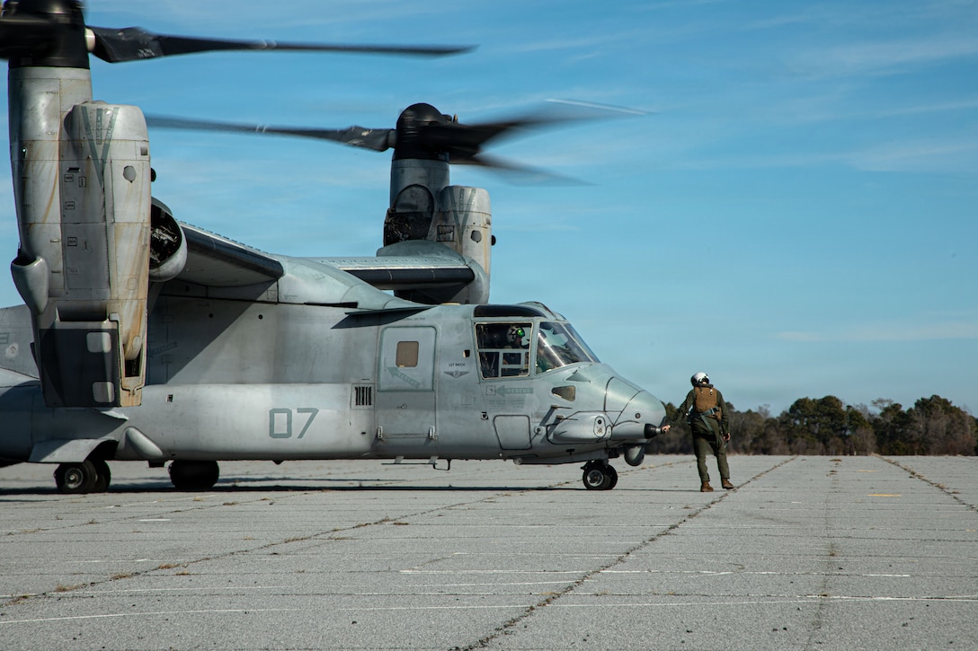 A U.S. Marine with Marine Medium Tiltrotor Squadron (VMM) 365 (Reinforced), 24th Marine Expeditionary Unit, preform preflight checks after an aviation delivery ground refueling during the MEU's certification exercise at Marine Corps Auxiliary Landing Field Bogue, North Carolina, Feb. 17, 2026. ADGR is a tactical capability allowing Marine Corps aircraft to refuel other aircraft or ground vehicles in austere, forward locations without established infrastructure. (U.S. Marine Corps photo by Lance Cpl. Payton Walley)
